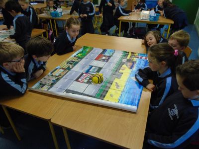 Senior Infants working with Bee-Bots