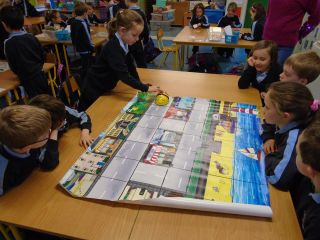 Senior Infants working with Bee-Bots