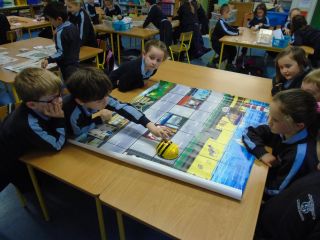 Senior Infants working with Bee-Bots